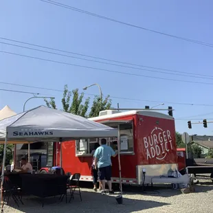 a man standing in front of a food truck