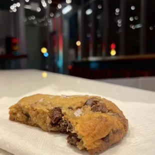 a chocolate chip cookie on a napkin