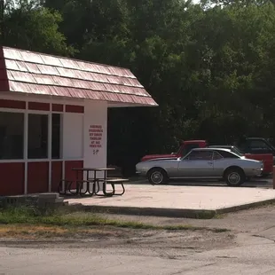 a car parked in front of a restaurant