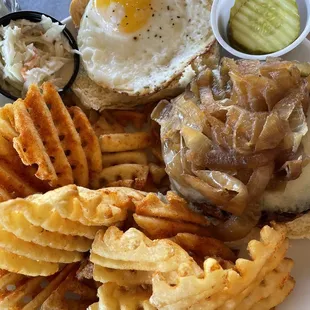 Impossible burger w/gruyere cheese, sautéed onions, pickles, slaw, a fried egg and waffle fries (spuds)