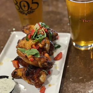 Island Jerk Wings up front with a pint of Daisy Cutter and one of Pumpkin Ale. Mouth watering good!