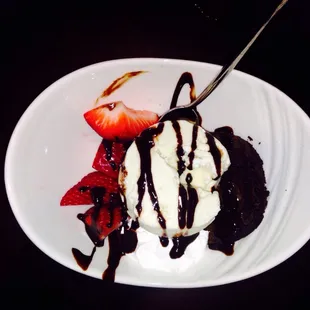 Dark/semi-sweet chocolate brownie wafers with vanilla ice cream and fresh strawberries. Not too sweet, but super yummy!