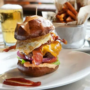 bacon, egg, cheese, and lettuce on a bun