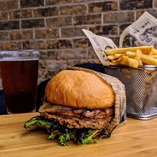 a sandwich and fries on a wooden table