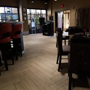empty tables and chairs in a restaurant