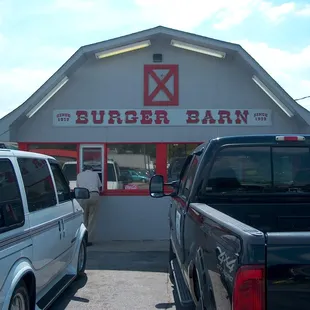 two trucks parked in front of the building