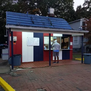 a man ordering food from a kiosk