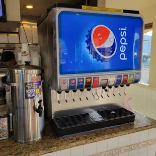 a pepsi vending machine in a restaurant