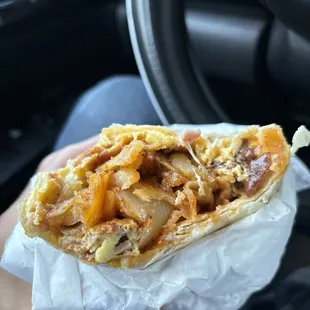 Don't mind how I hold the Burrito .  it's really big   - FLAMESburrito special