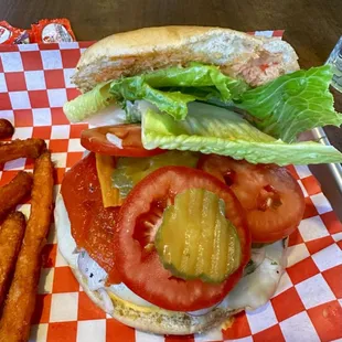 Closeup of Peruvian Burger - don't worry beneath the tomatoes is a nice fat patty.