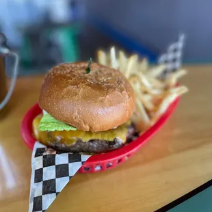 a hamburger and fries on a table