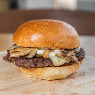 a burger on a wooden board