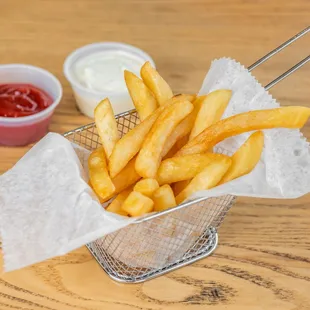 a basket of french fries and ketchup