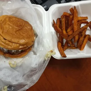 The Signature Burger~ with Swiss cheese,  mushrooms, and Mayo aioli sauce. With sweet potato fries