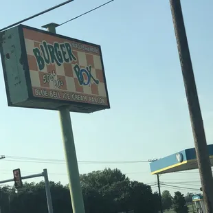 a sign for a burger box