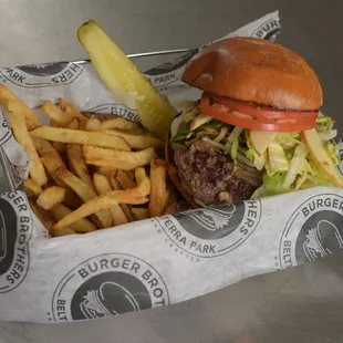 a basket of fries and a pickle