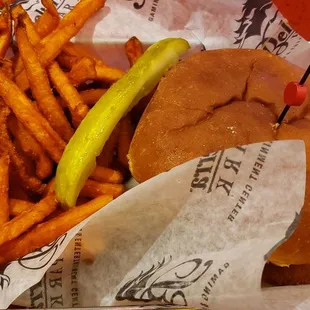 a basket of fries and a pickle