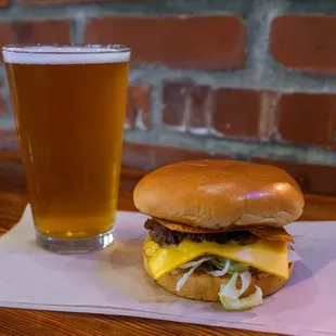 a glass of beer and a burger