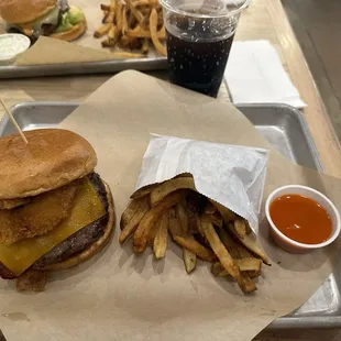 &quot;John Wayne&quot; cowboy burger with bacon, cheddar, and onion rings, buffalo dry dip, and a Diet Pepsi (no coke). $39 with tip for both meals