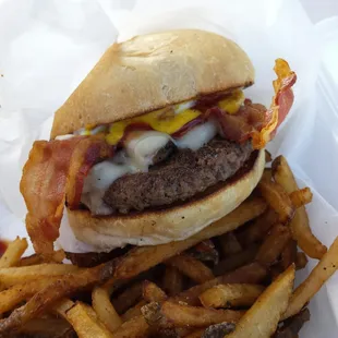a burger and fries in a basket