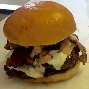 Double cheeseburger with bacon and jalapeños, all the way with homemade burger sauce.  Ricky said he wolfed it down in minutes!