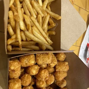 Shoestring fries (ask , not on menu)  and tater tots, generous portions. We could have shared one.