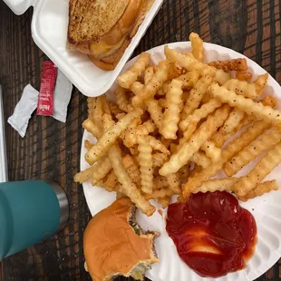 Single burger with cheese, pickles, and crush sauce. Regular fries and a grilled cheese