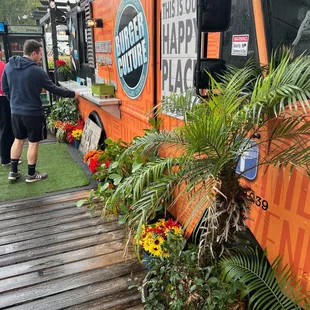 a food truck decorated with plants