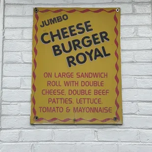 a sign on a brick wall