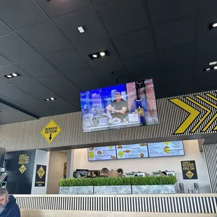 a man sitting at a table in a restaurant