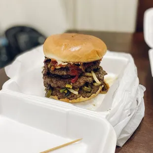 Monsters burger, comes with 3 patties, bacon, sautéed jalapeños, sautéed onions, mayo, mustard and barbecue sauce.