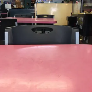 a pink table and chairs