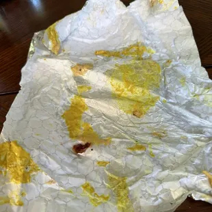 Mustard soaked wrapper and bottom bun.