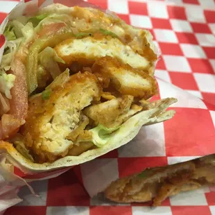 a wrap of chicken and lettuce
