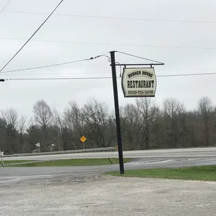 The only road sign, so watch for it.