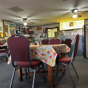 a dining room with tables and chairs