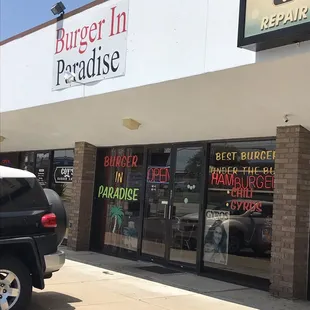 a car parked in front of the restaurant