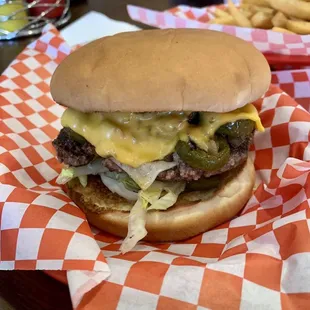 cheeseburger and fries on checkered paper