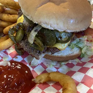 Bacon burger with grilled onion and jalapeños added
