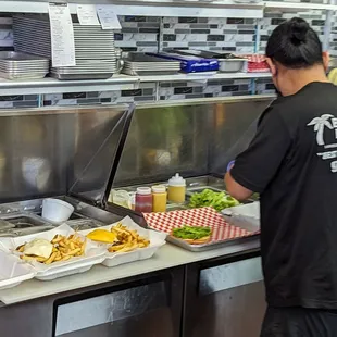 a man preparing food in a restaurant kitchen