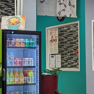 a small refrigerator with drinks in it
