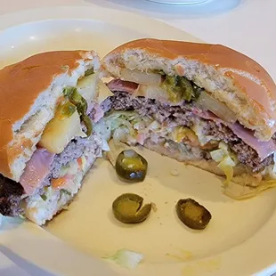 1/2 pound Hawaiian burger [ w/ Jalapeños ] pineapple slices, Swiss cheese, ham slices, so good!