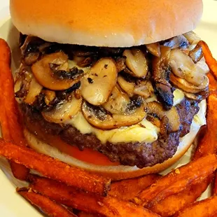 Mushroom Burger on a blanket of sweet potato fries at Burger Island.
