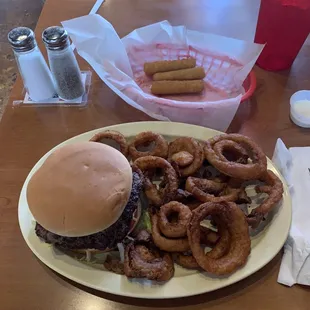 Double hamburger with onion rings and mozzarella sticks