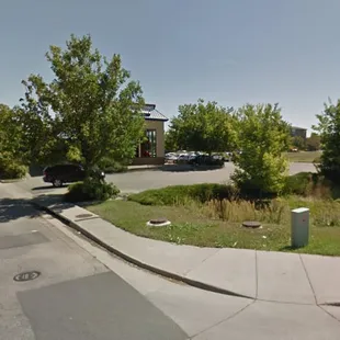 a parking lot with parked cars