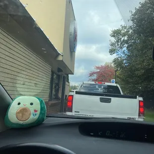 a stuffed animal in the back of a truck