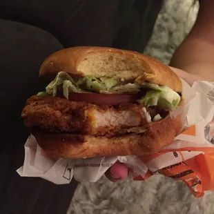 a chicken sandwich with lettuce and tomato