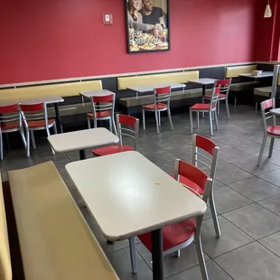 empty tables and chairs in a restaurant