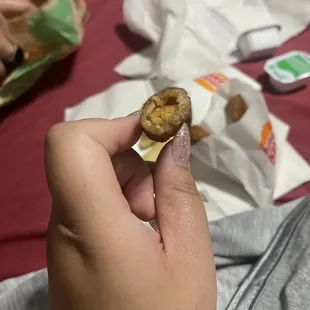 Mozzarella sticks have been sitting out on the hot plate for hours they're OLD. They're hard af