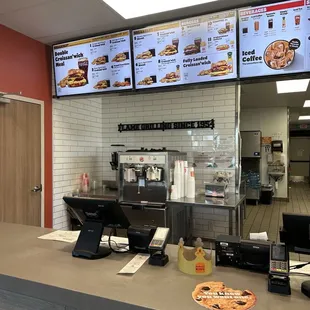 the counter and menus of the restaurant